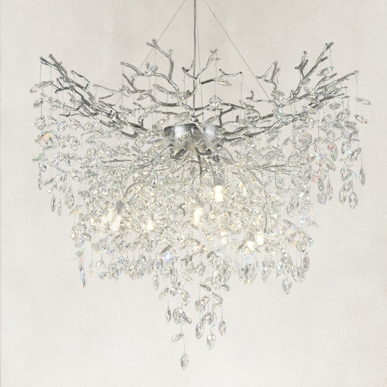Illuminated silver-finish crystal branch chandelier with a deep cascade of drops