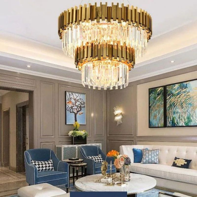 Double-crown crystal chandelier above a coffee table and seating area.