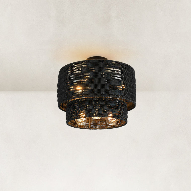 Black complete woven fixture illuminated low-angle view.