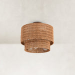 Natural-tone woven fixture underside with visible unlit lamp region.