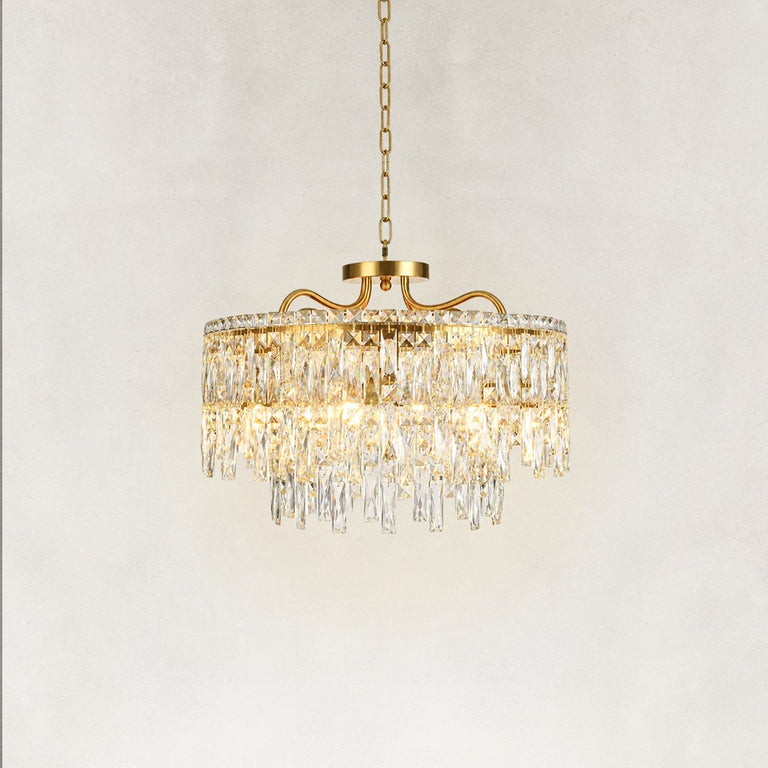 Illuminated faceted crystal drum chandelier showing layered crystal detail
