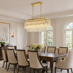 Faceted crystal linear chandelier above a formal rectangular dining table
