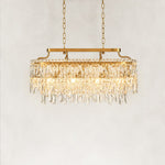Illuminated front view of the faceted crystal linear chandelier