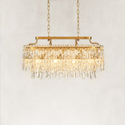 Illuminated front view of the faceted crystal linear chandelier