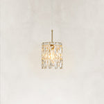 Illuminated faceted crystal mini pendant viewed from the front