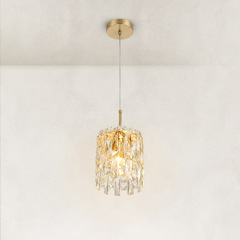 Three-quarter view of the faceted crystal mini pendant and brushed gold frame