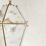 Product detail of Faceted Marble Lantern Pendant against a neutral background