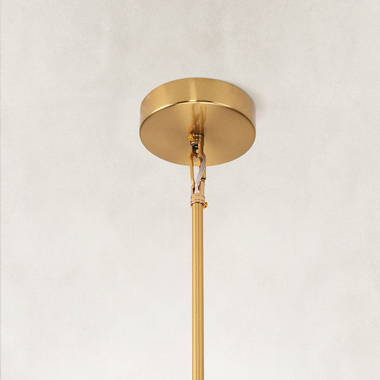 Gold-colored pendant canopy and rod connection.