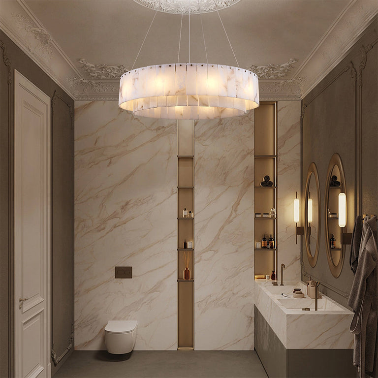 Layered alabaster ring chandelier with gold-tone canopy in a bathroom.