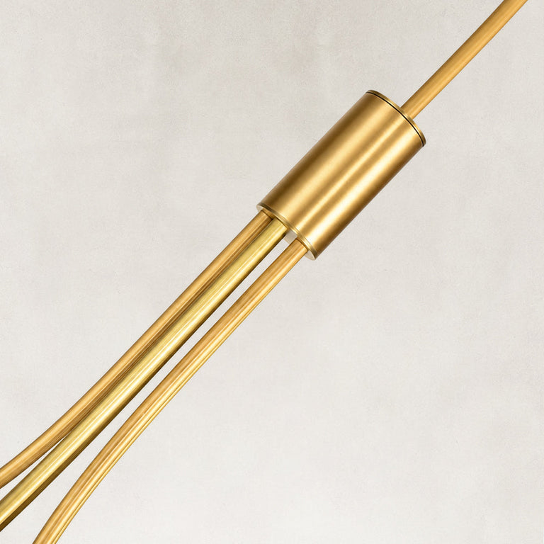 Gold-tone chandelier central sleeve and rod bundle close view