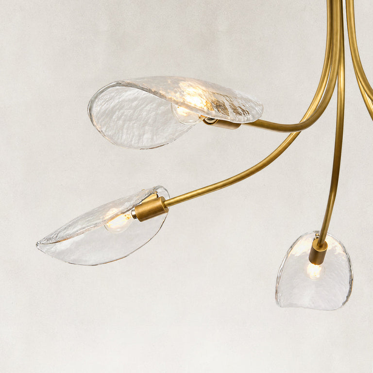Gold-tone chandelier glass shades and lamp holders close view