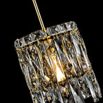 Gold-tone crystal pendant light on dark background close view