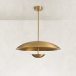 Gold-tone disc pendant complete fixture against a neutral background