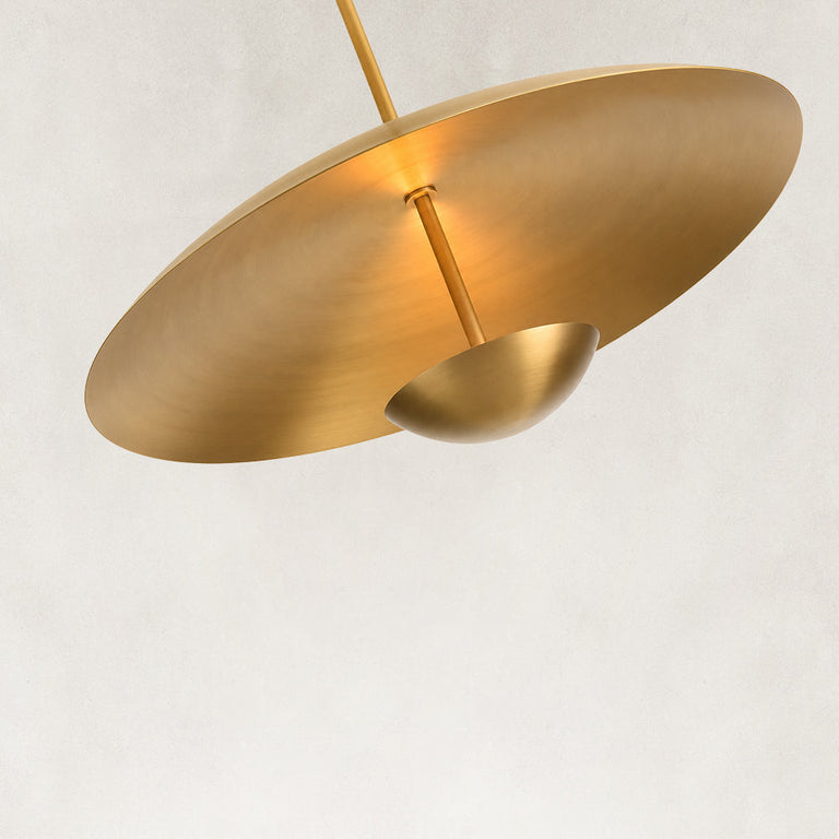 Gold-tone disc pendant shade viewed from below
