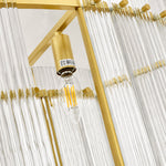 Gold-tone glass rod chandelier bulb socket and clear glass rod close view
