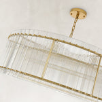 Gold-tone glass rod drum chandelier alternate angle with chain and canopy
