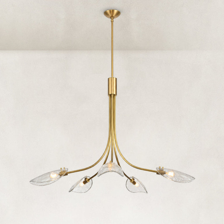 Gold-tone leaf glass chandelier complete fixture illuminated against a neutral background