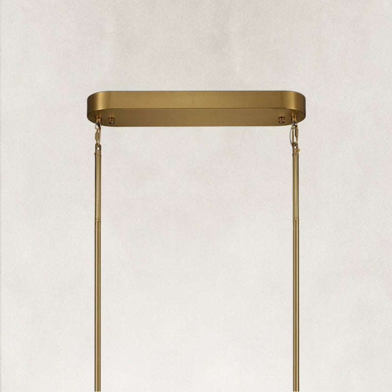 Gold-tone oval chandelier ceiling canopy and suspension close view
