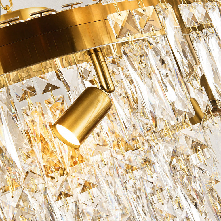 Gold-tone tiered crystal chandelier, holder and crystal pendants close view