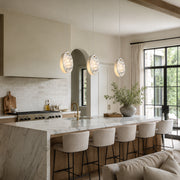 Graphic Vein Marble Disc Pendant displayed in a furnished interior
