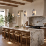 Graphic Vein Marble Disc Pendant displayed in a furnished interior