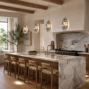 Graphic Vein Marble Disc Pendant displayed in a furnished interior