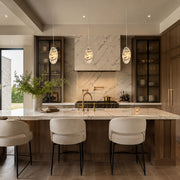 Graphic Vein Marble Disc Pendant installed above a kitchen island