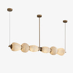 Handcrafted Alabaster Pebble Linear Chandelier – Gold & White LED by Dalmivik, product or room detail view