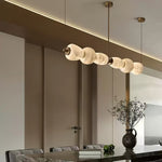 Handcrafted Alabaster Pebble Linear Chandelier – Gold & White LED by Dalmivik, product or room detail view