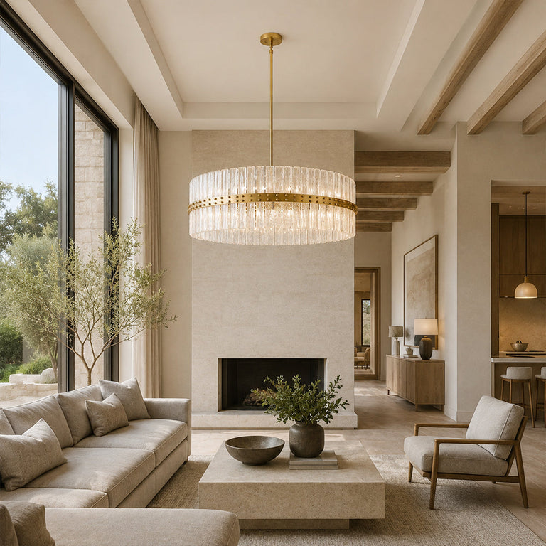 Glass drum chandelier above a stone coffee table facing a fireplace.