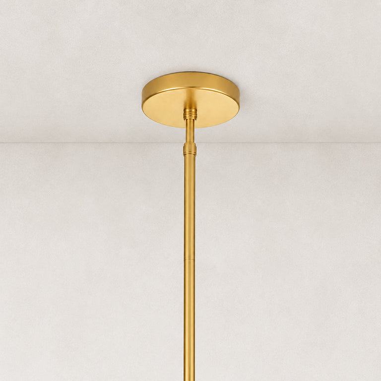 Glass drum chandelier, gold-tone ceiling canopy and rod close view.