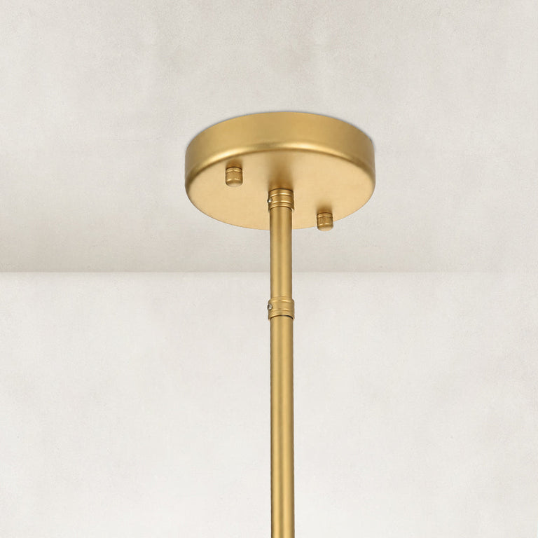 Glass drum chandelier, round canopy and rod at the ceiling.