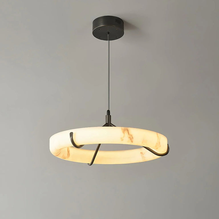Illuminated alabaster ring pendant with three black supports against a gray background