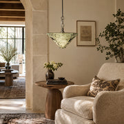 Inverted Pyramid Marble Pendant displayed in a furnished living room