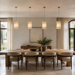 Ivory Veined Twelve-Panel Marble Lantern Pendant installed above a dining table