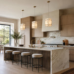 Ivory Veined Twelve-Panel Marble Lantern Pendant installed above a kitchen island