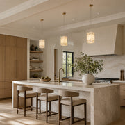 Ivory Veined Twelve-Panel Marble Lantern Pendant installed above a kitchen island