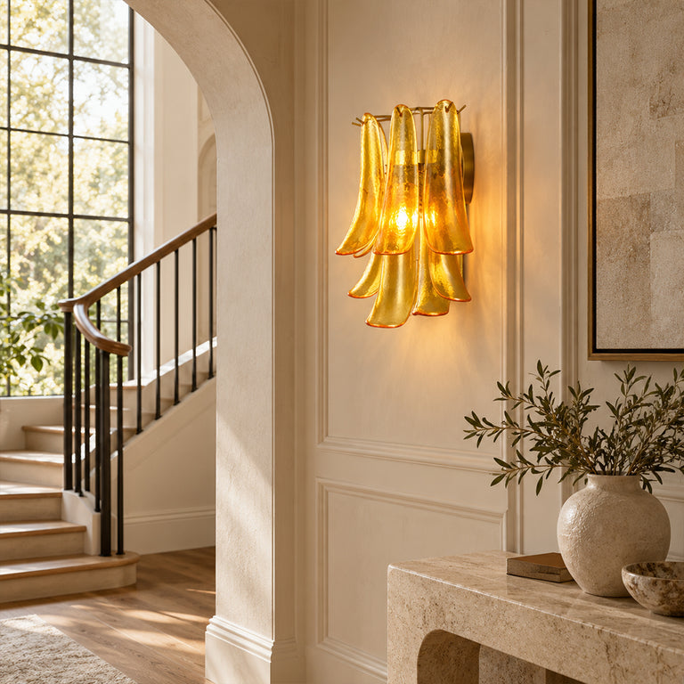 Layered curved glass wall sconce in a room setting