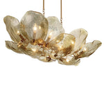 Elongated gold glass petal chandelier seen from below at an angle.