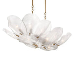 Elongated white glass petal chandelier with brass-tone details seen at an angle.