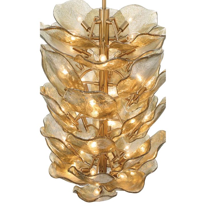 Tall layered gold glass petal chandelier seen from the side.