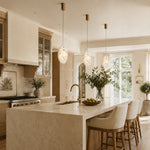 Layered Ivory Marble Disc Pendant installed above a kitchen island