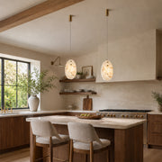 Layered Ivory Marble Disc Pendant installed above a kitchen island