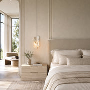 Layered White Marble Blade Pendant installed beside a bed in a furnished bedroom