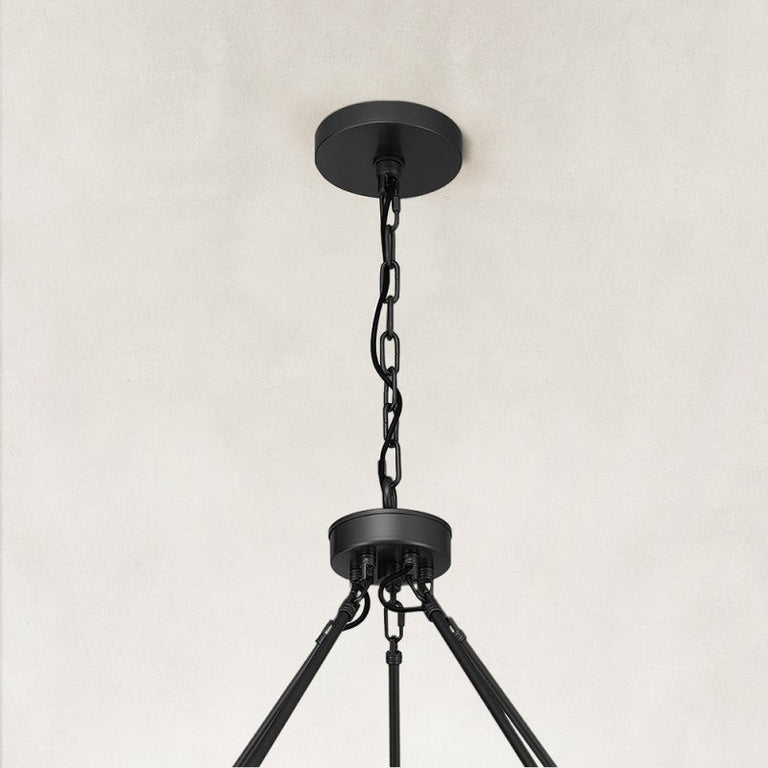 black two-tier glass-tube chandelier canopy detail.