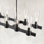 Linear glass-tube chandelier, black holders and staggered glass tubes.