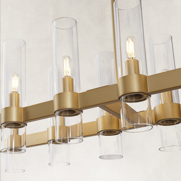 Linear glass-tube chandelier, brass-tone holders and staggered tubes.
