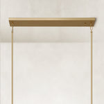 Linear glass-tube chandelier, brass-tone linear canopy and rods.