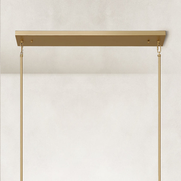 Linear glass-tube chandelier, brass-tone linear canopy and rods.