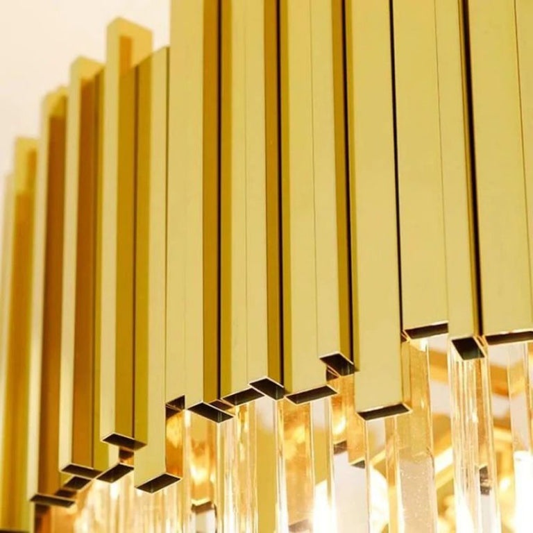 Detail of the long chandelier's gold-tone crown fins.